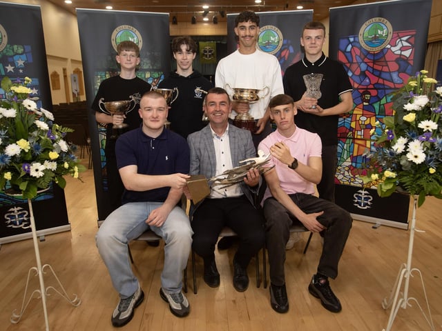 Mr. Burns, Head of PE, presenting the Tony Furey Prize for Sporting Excellence to Conor Barr and Oisin Dobbins at Thursday's Prizegiving in St. Columb's College. Back from left are, James Campbell, Tom Dunbar Award for Commitment, Shea Martin, Brendan Dolan Award for Gaelic Football, Christian Sweeney, The Basketball Prize, and Riley Fitzpatrick, Derry City F.C. Prize for Soccer. (Photos: Jim McCafferty Photography)