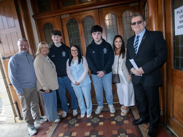 Mrs. McLaughlin and Mr. Chambers pictured with Year 14 students and their parents before Thursday's Valedictory Mass. : .