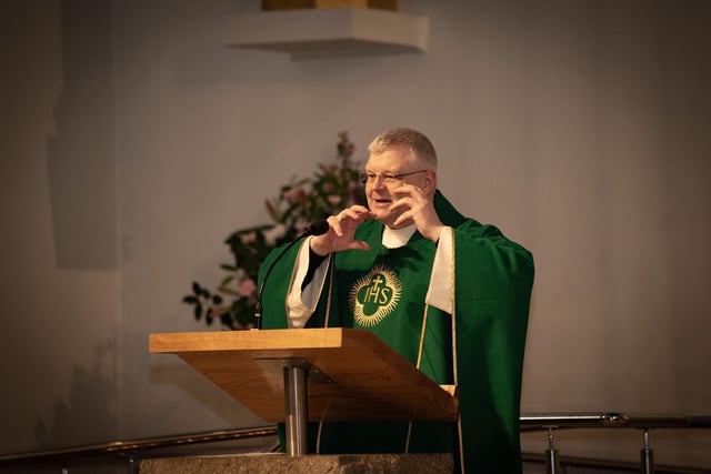 Fr. Daniel McFaul celebrating 'Grandparents To School' Day at St. Mary's Church, Creggan to a packed congregation of grandparents and grandchildren from Holy Child PS. (Photos: Jim McCafferty Photography)
