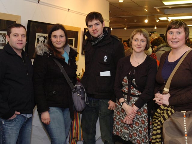 Photography students, from left, Paul Colhoun, Sylvia Perdiguero and Gerard Donnelly with Eden Place Arts Centre co-ordinator Judy Logue and photography tutor Janeen Whiteside at the end of term exhibition. (2212PG04)