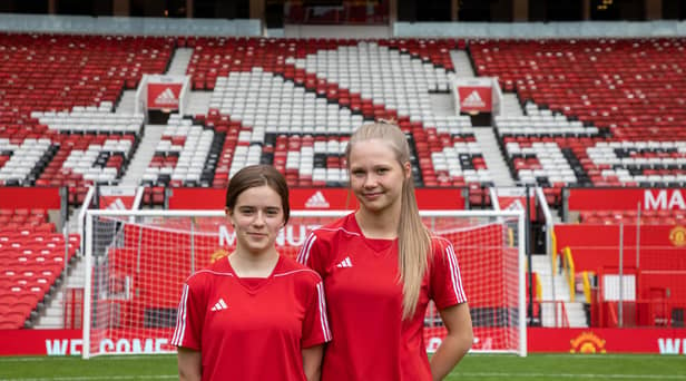 Courtney and Ava on the hallowed Old Trafford turf.