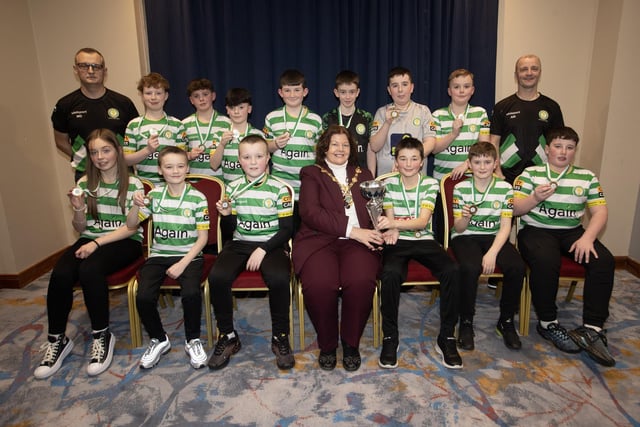 The Mayor, Patricia Logue, pictured at the D&D Youth FA Annual Awards at the City Hotel on Friday night presents Top of the Hill Celtic U12s with the League Trophy. Included are coaches Martin Doherty and Aidan Wilson.