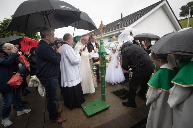 WELLS BLESSED. . . . .Bishop Donal McKeown performs the Annual Blessing of the Water at St. Columb's Well on Sunday to celebrate the Feast of St. Columba. (Photos: Jim McCafferty Photography)