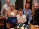 WELL DONE KYLE!. . . .The Deputy Mayor of Derry City and Strabane District Council, Angela Dobbins making a special presentation to Derry teenager Kyle Moore in recognition of his recent success in the WAKO World Championships in Italy and his gold medal success at the Bristol Open, during a reception in his honour at the Mayor’s Parlour, Guildhall on Thursday night last. Included are Kyle’s parents Paul and Shauna and his coach Gary Kelly.
