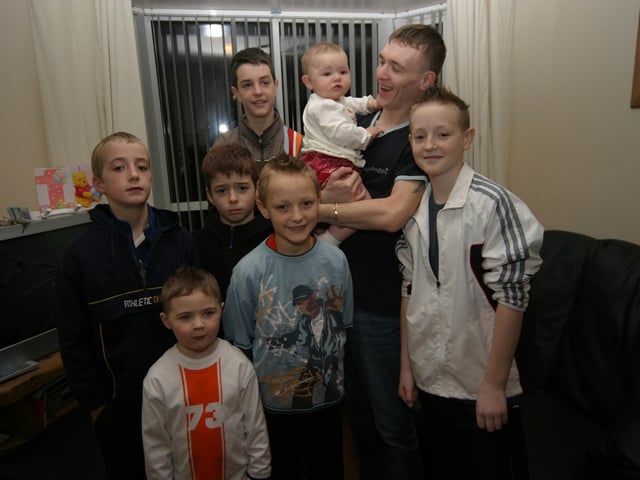 Dad Emmett, Sean, David, Keith, Jason, Ryan, Jason and Kevin enjoy the birthday party with Nicole. 0013/JML