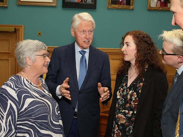 Bill Clinton chats to the Trimble family.