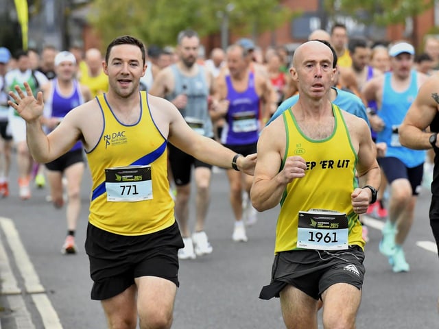 First Wave runners in the WatersideHalf Marathon make their way out of Ebrington Square towards Limavady Road. Photo: George Sweeney