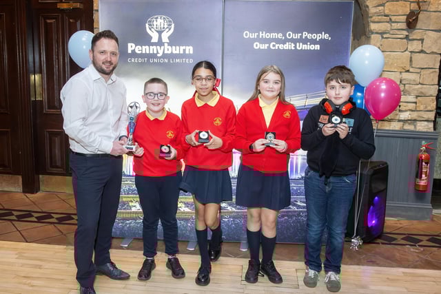 Winners of Competition B - Steelstown PS Brainy Bolts (L to R - Pennyburn CU CEO Frank Doherty, Eoin, Kamara, Emily and Jack).