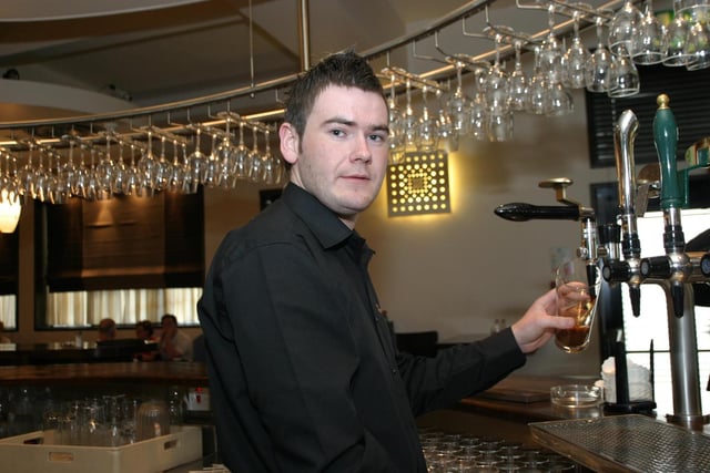 PubEye: Stevie Coyle pours a pint for one the regulars at The Exchange Bar. Folks out enjoying a tasty meal and few drinks at The Exchange.