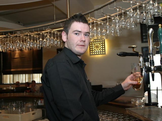 PubEye: Stevie Coyle pours a pint for one the regulars at The Exchange Bar. Folks out enjoying a tasty meal and few drinks at The Exchange.