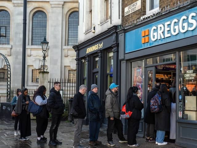 LONDON, ENGLAND - DECEMBER 8: People queue for Greggs on December 08, 2023 in London, England. (Photo by Carl Court/Getty Images)