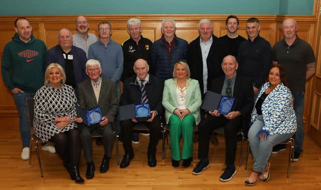 Mayor Sandra Duffy who presented special honorary service awards to three members of Derry & District Football Association at a civic reception held in the Guildhall. Seated from left are Anne Gallagher, Jobby Crossan (who received the award on behalf of his brother Jimbo), Liam Smyth, and from right, Helene Crossan and Willie Barrett. Also included are members of the D&D. (Photo - Tom Heaney, nwpresspics)