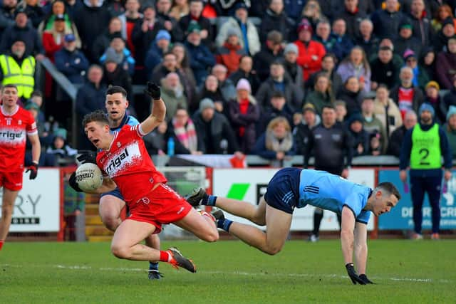 Dublin's Paddy Small tackles Shane McGuigan of Derry. Photo: George Sweeney