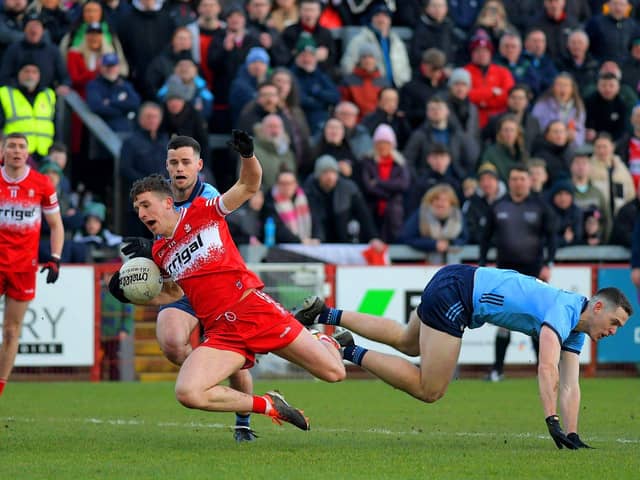 Dublin's Paddy Small tackles Shane McGuigan of Derry. Photo: George Sweeney