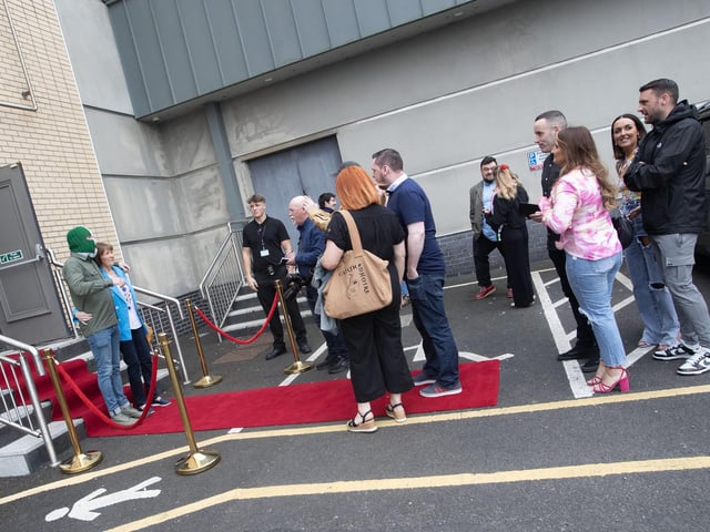 PHOTO OPP!. . . .Queuing up for a photo with DJ Provai before Sunday's screening of 'Kneecap' at the Brunswick Moviebowl in Derry on Sunday evening. (Photo: Jim McCafferty Photography)