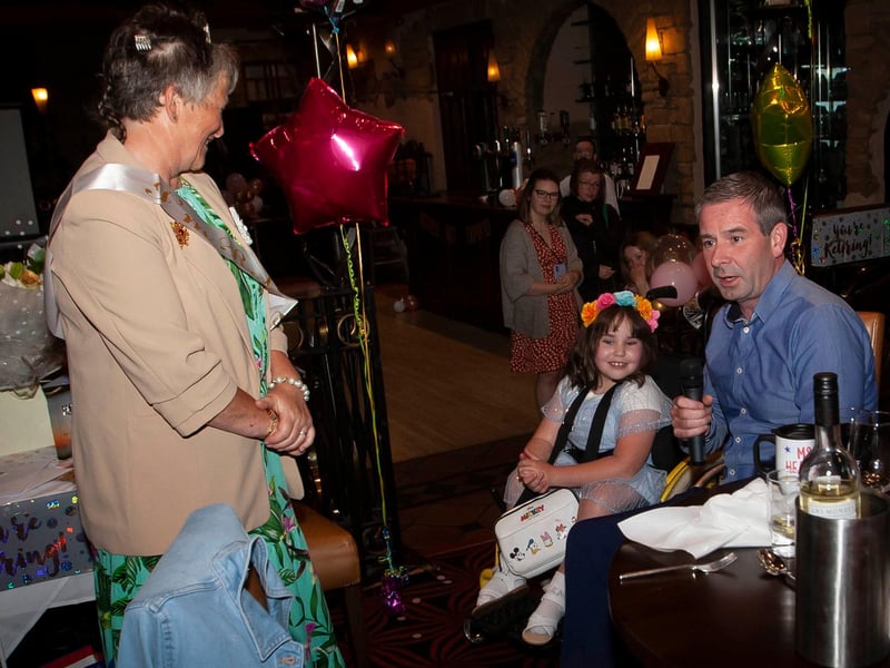 Ms. Heaney's niece and pupil at the school, Amelie Curran, gets ready to sing at the retirement function.
