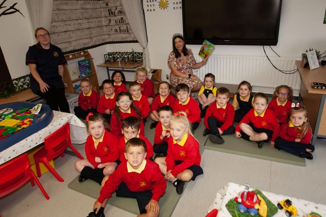Mrs. Neidin Kelly pictured with her P1 class at Steelstown PS this week. On left is Miss Katie Barnfield, Classroom Assistant. (Photos: Jim McCafferty Photography):.