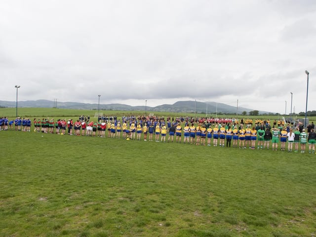 Ladies line up for the National Anthem during Saturday's event at Beart GAC.
