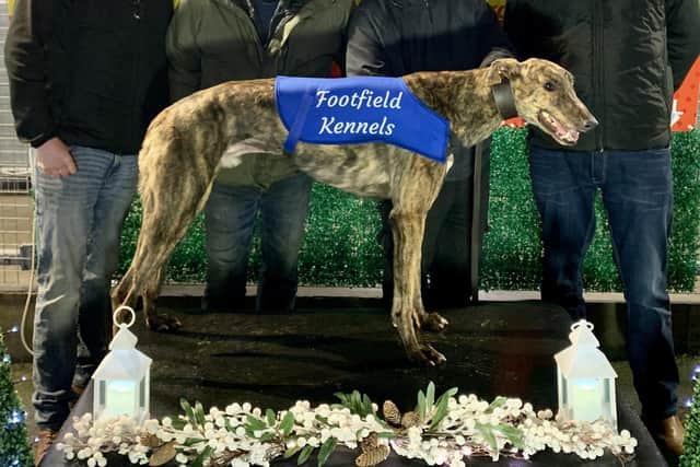 La Rey won won the postponed Footfield Kennels Christmas Cup Consolation Final in 29.71 with (from left) Martin Hagan, trainer Michael Corr, John McGorry & Eamon Hagan.