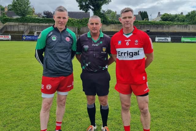Tyrone captain captain Conor Gormley and Derry captain Brian Mullan at O'Cahan Park on Saturday.