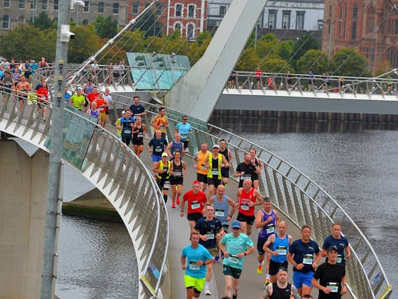The 2024 Waterside Half Marathon competitors make their way across the Peace Bridge. Photo: George Sweeney