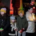 Children hold candles at the procession and vigil for the children of Palestine at the Bloody Sunday Monument on Rossville Street. Photo: George Sweeney