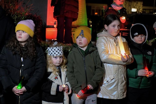 Children hold candles at the procession and vigil for the children of Palestine at the Bloody Sunday Monument on Rossville Street. Photo: George Sweeney