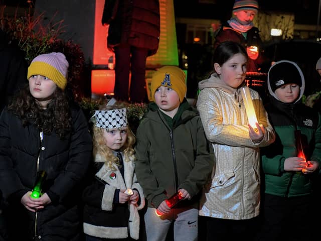 Children hold candles at the procession and vigil for the children of Palestine at the Bloody Sunday Monument on Rossville Street. Photo: George Sweeney
