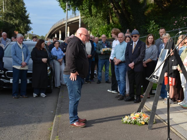 A wreath is laid in memory of Charles.
