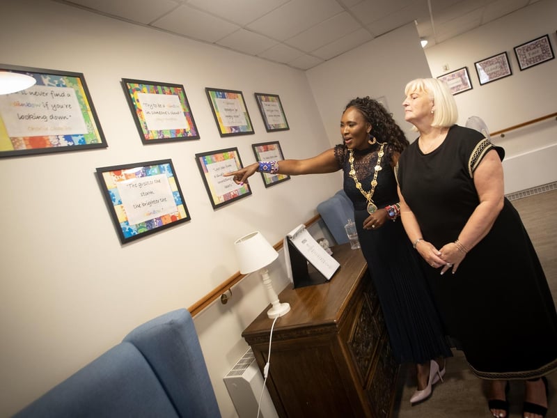 The Mayor, Lillian Seenoi-Barr admiring some of the artwork given to Longfield Care Home by local schoolchildren.