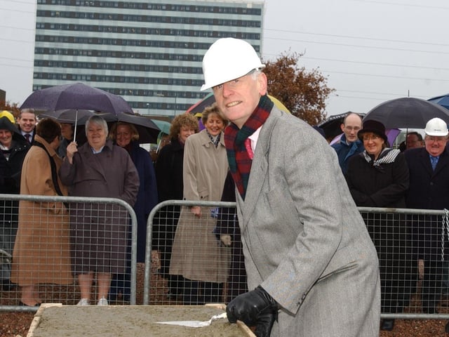 Dr Don Keegan, Consultant Altnagelvin Hospital, planting a tree at the site of the new Rehabilitation Unit at site.