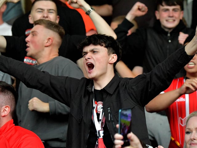 Derry City fan celebrates Will Patching’s winning goal against against Sligo Rovers on Friday evening. Photo: George Sweeney. DER2327GS – 071