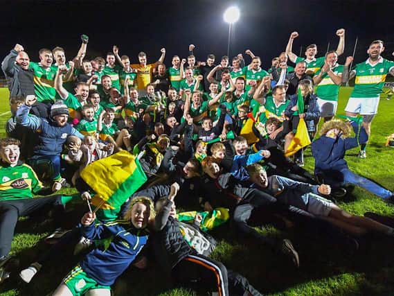 Ballymaguigan players and fans celebrate their Junior Football Championship final win over Moneymore at Owenbeg on Saturday evening.  Photo: George Sweeney