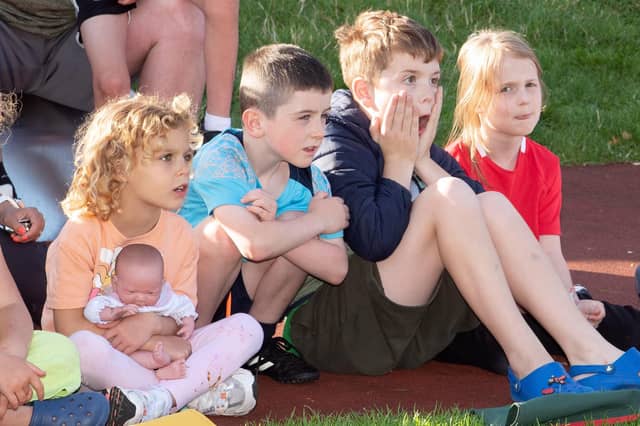 HOW DID THEY DO THAT? . . . .Children enjoying the Circada Circus Duo's performance at the Féile 24's event in Abercorn Park on Tuesday.
