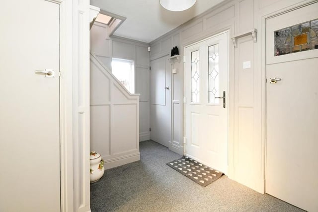 The entrance hall is welcoming, with its fitted carpet flooring, radiator, uPVC double-glazed window to the side and storage cupboard under the stairs.