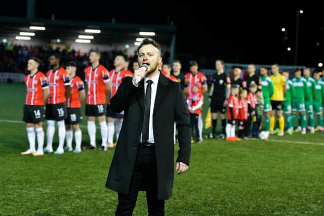 Derry singer songwriter Conor McGinty performs the National Anthem in front of a packed Ryan McBride Brandywell Stadium. Photograph courtesy of Kevin Morrison (Event Images and Video)