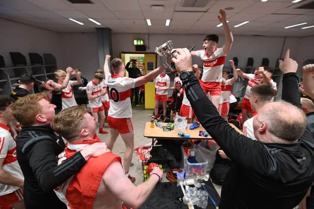 Derry players and management celeb rate in the Croke Park changing room.