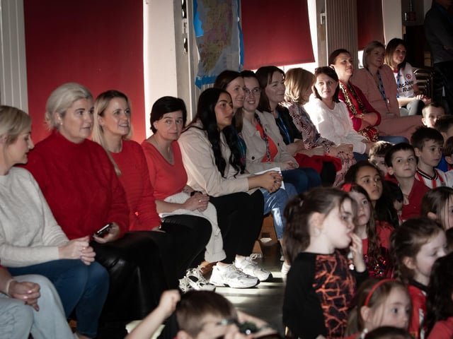 Staff and pupils gather to show the support of the school for the Derry City players.
