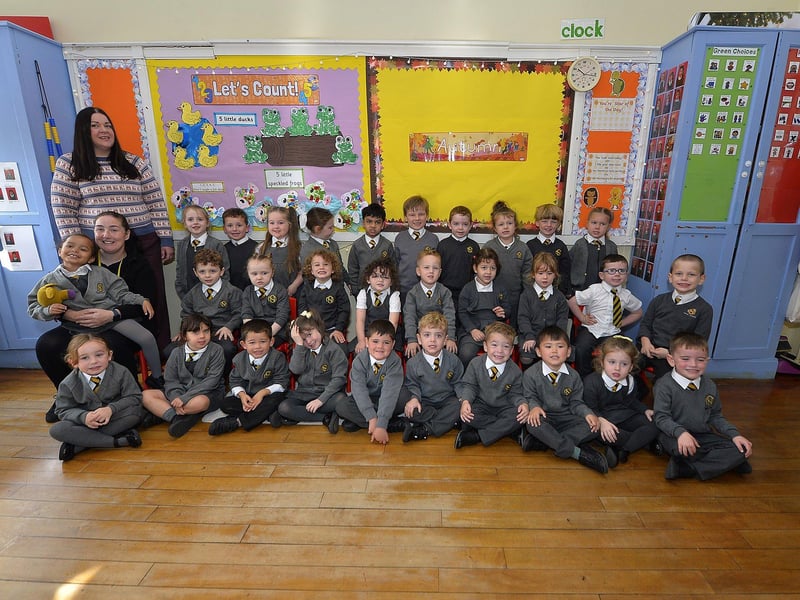 Teacher Mrs Gallen (standing) with P1 pupils and classroom assistant Mrs Coyle at the Model Primary School.