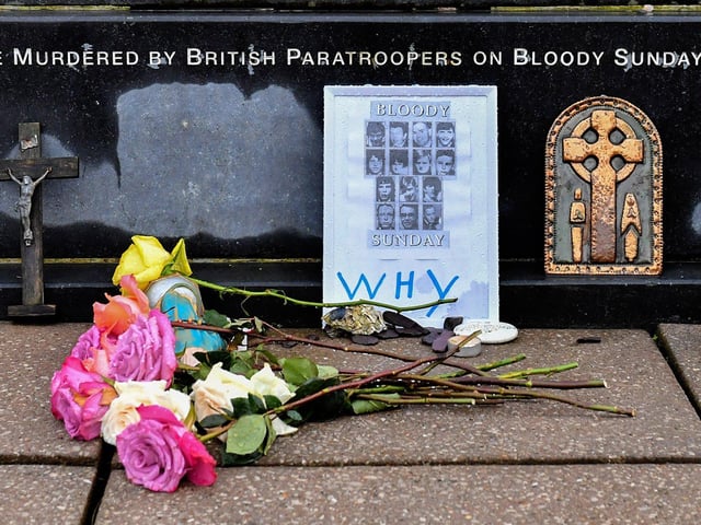 Photograph of those murdered on Bloody Sunday placed at the Bloody Sunday monument. Photo: George Sweeney