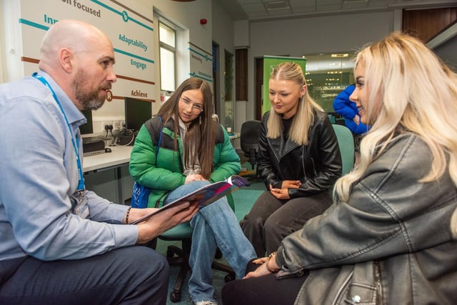 Health lecturer Kevin Gallagher gives advice to Sinead McGrath, Addison Cummings and Caoimhe Campbell at Open day at Strand Road campus.
