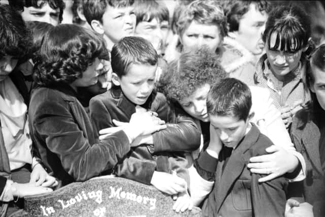 Stephen's brothers Emmett and Mark at the funeral in 1982.