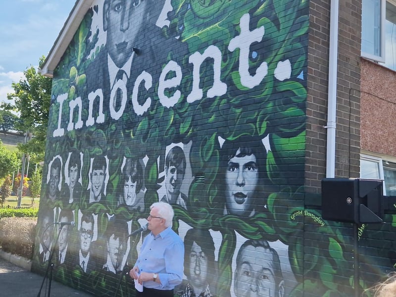 John Kelly with the mural in the background.