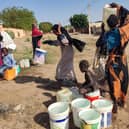 People fetch water in Al- Kamilin which was retaken by the Sudanese, in Sudan's al-Jazira state on February 19, 2025. Since it erupted in April 2023, the war between the army and Rapid Support Fprces paramilitaries has killed tens of thousands of people, forced over 12 million to flee their homes, and created "the biggest humanitarian crisis ever recorded" according to the International Rescue Committee. (Photo by AFP) (Photo by -/AFP via Getty Images)