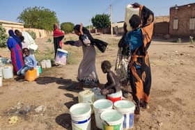 People fetch water in Al- Kamilin which was retaken by the Sudanese, in Sudan's al-Jazira state on February 19, 2025. Since it erupted in April 2023, the war between the army and Rapid Support Fprces paramilitaries has killed tens of thousands of people, forced over 12 million to flee their homes, and created "the biggest humanitarian crisis ever recorded" according to the International Rescue Committee. (Photo by AFP) (Photo by -/AFP via Getty Images)