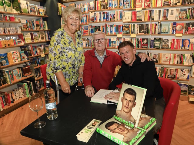 Professional footballer James McClean signing his autobiography, “The Walls” in Waterstones, Foyleside, for Derry City FC lifelong fans, Mick and Therese McBride. (Photo - Tom Heaney, nwpresspics)