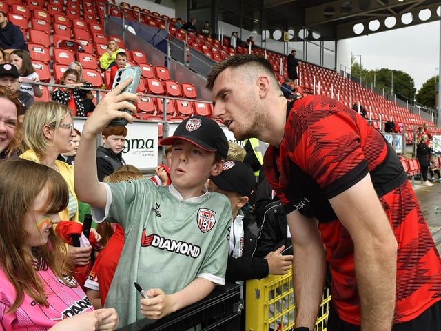 Hayden Cann gets in a selfie with a fan at the Derry City open training session on Monday morning in  Brandywell Stadium. The event was organised at part of the Gasyard Feile.  Photo: George Sweeney / Derry Journal