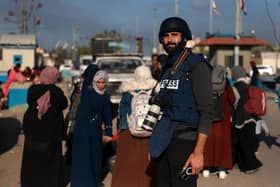 Palestinian photojournalist Motaz Azaiza stands in a street in the central part of the Palestinian territory on December 18, 2023. (Photo by Mohammed ABED / AFP) (Photo by MOHAMMED ABED/AFP via Getty Images)