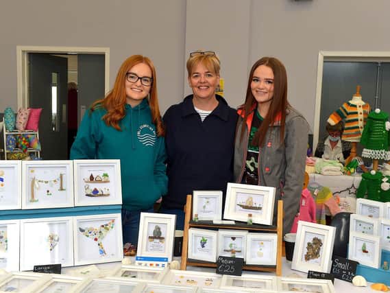 Kerry, Michele and Anna McKinney pictured at their Wild Atlantic Sea Art stall at the Spring Craft Fair held in St Mary’s Hall Muff on Sunday last. Photo: George Sweeney. DER2310GS – 003