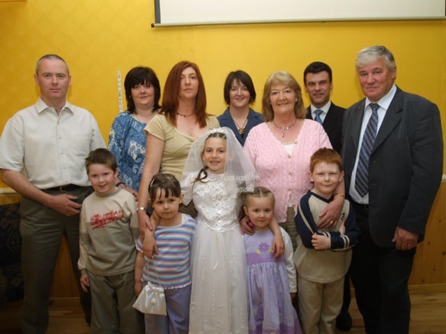 Gemma with her family on the occasion of her First Communion.